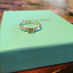 Tiffanys stacking ring peridot stone.
