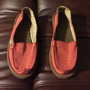Red sanuk slip on's. Worn only a couple of times.