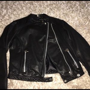 Topshop collarless leather jacket.