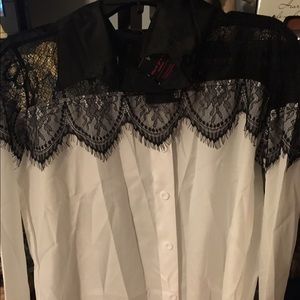 White blouse w/ black lace shoulders.
