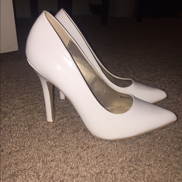White pointed toe pumps