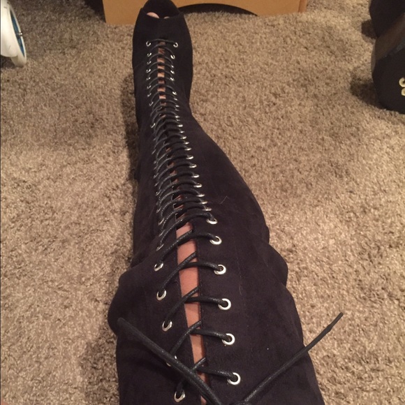 Thigh high laced up boots