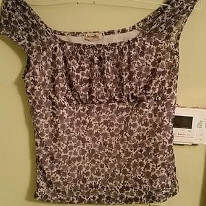 Large floral sleeveless style blouse