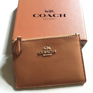 Brand new tan coach card holder. original tags.