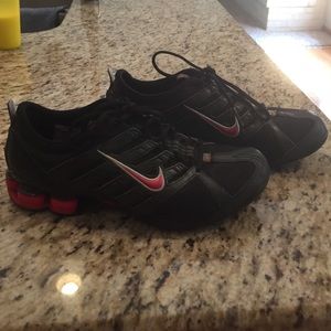 Black and Red woman's 7 Nike Shox