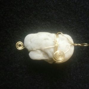 Hand wrapped beach stone pendant