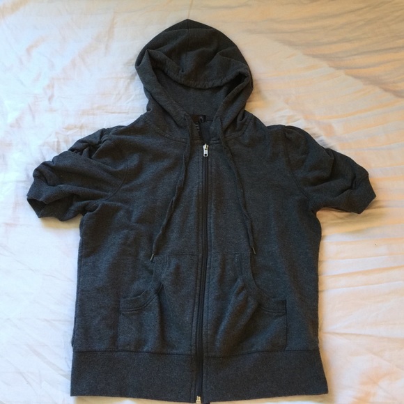 Cute short sleeve zip up sweater top with hood.
