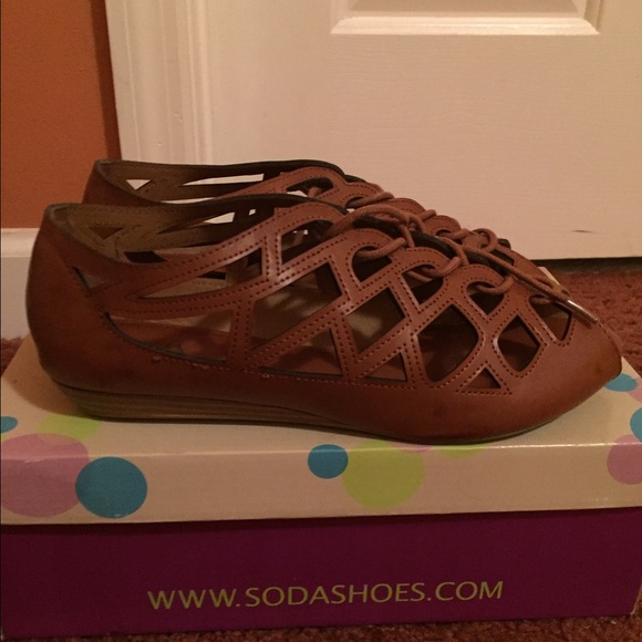 Tan laser cut caged shoes