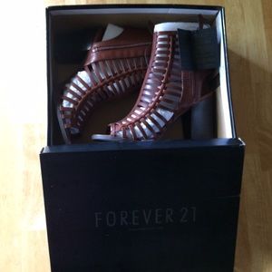 Brown gladiator sandal with a chunky heel