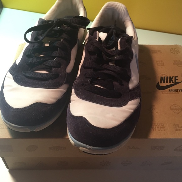 Blue and white Nike tennis shoes