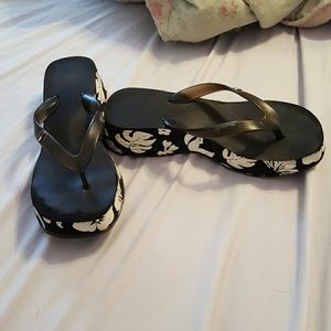 heeled flip flops and floral shorts