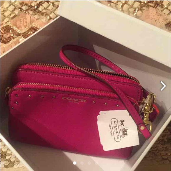 Bright magenta Coach Wristlet
