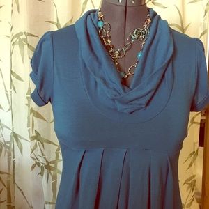 Turquoise knee length dress.