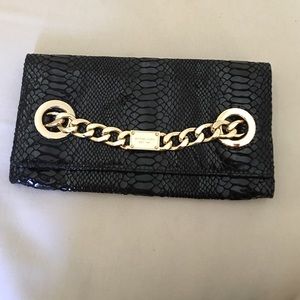 Brand new black Michael Kors clutch