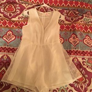 White romper w/ long slit in front. Small.