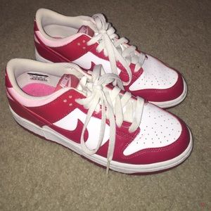 White, red, and pink Nike shoes.