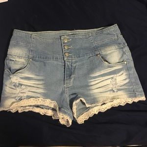 Ripped denim shorts with lace accent!