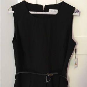 Calvin Klein black sleeveless peplum blouse