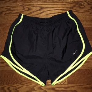 Black and neon yellow Nike shorts