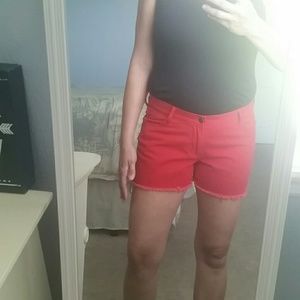Red fringed denim shorts
