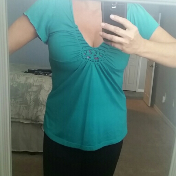 Green/turquoise top.