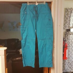 Dickies xl tall scrub pants teal in color.