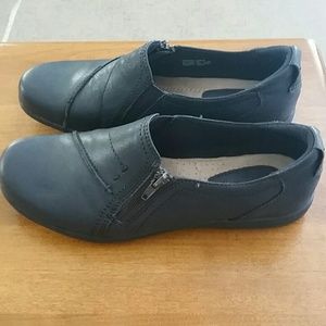 Black leather slip ons