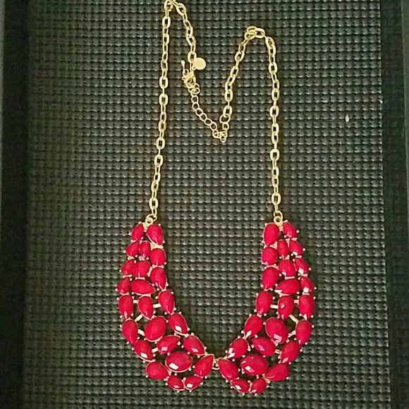 Red beaded necklace with gold chain.