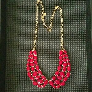 Red beaded necklace with gold chain.