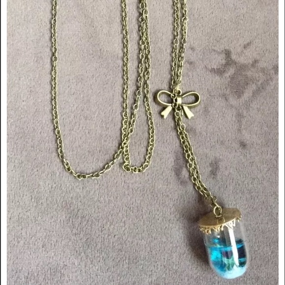Sea in a bubble necklace with bow accent.