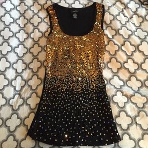 Gold sequin tank top.