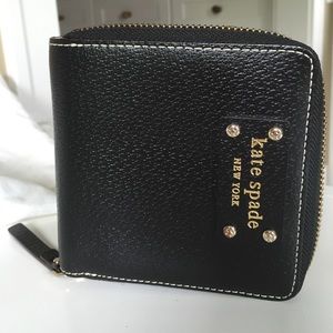 Kate Spade zip up wallet.