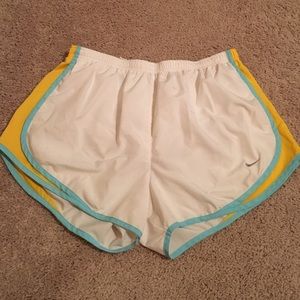 White, yellow and blue Nike DRI FIT shorts