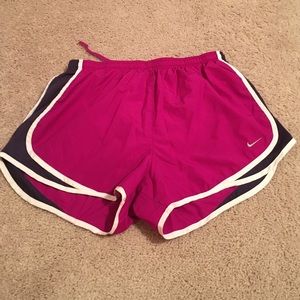 Magenta and dark purple Nike DRI FIT shorts