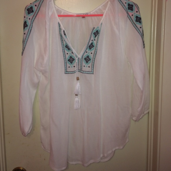 Thin white "tribal like" top