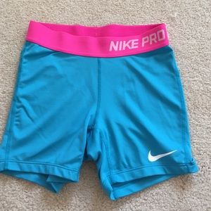 turquoise with pink band Nike pro spandex