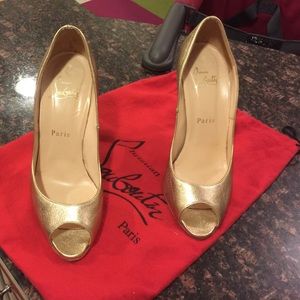 Christian Laboutin gold peep toe pumps