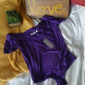 BNWT Eva Mendes purple one piece body suit.