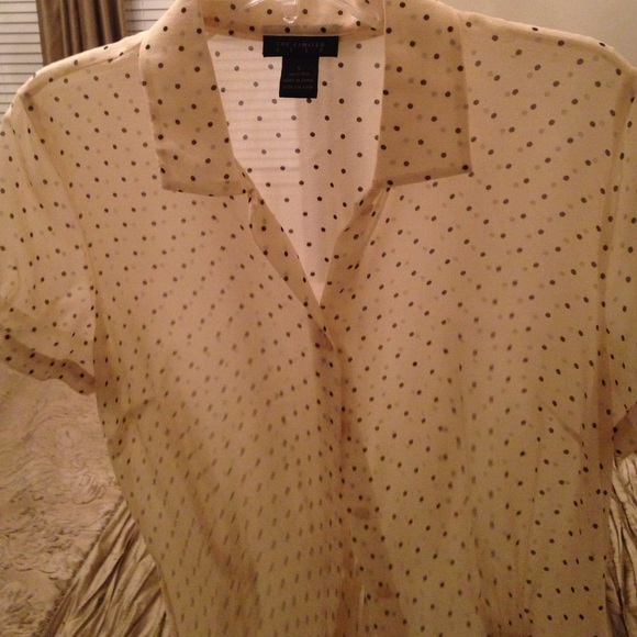 100% silk, buttoned & cap sleeves, very sheer