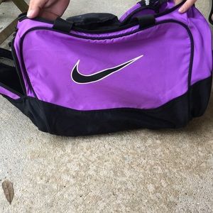 purple Nike duffle bag