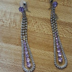 purple earrings and silver ring
