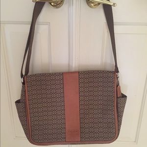 Coach hand bag. To big for what a need it.