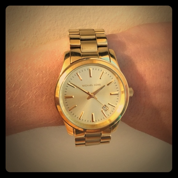 New Michael Kora gold runway watch
