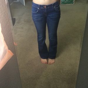 Dark blue jeans with brown seam