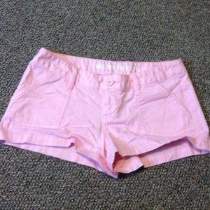 Pink short shorts.