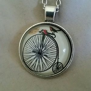 Little bird riding a bicycle silver charm necklace