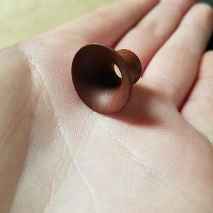 Natural wood gauges size 00. NEVER WORN,