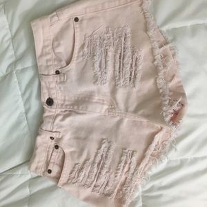 Distressed pink shorts