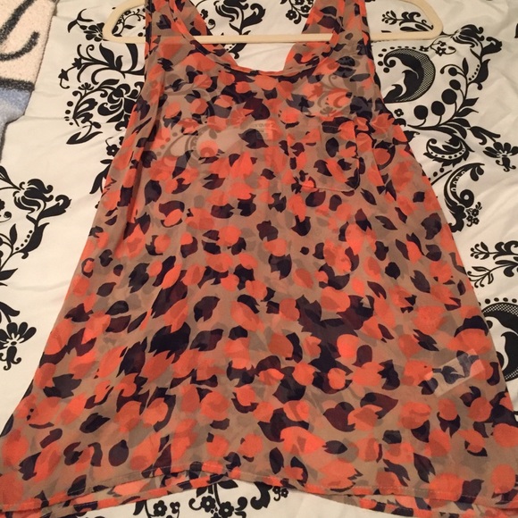 Sheer tank. Orange and navy print.
