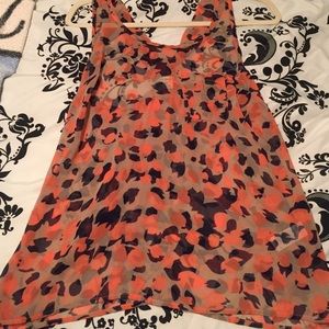 Sheer tank. Orange and navy print.